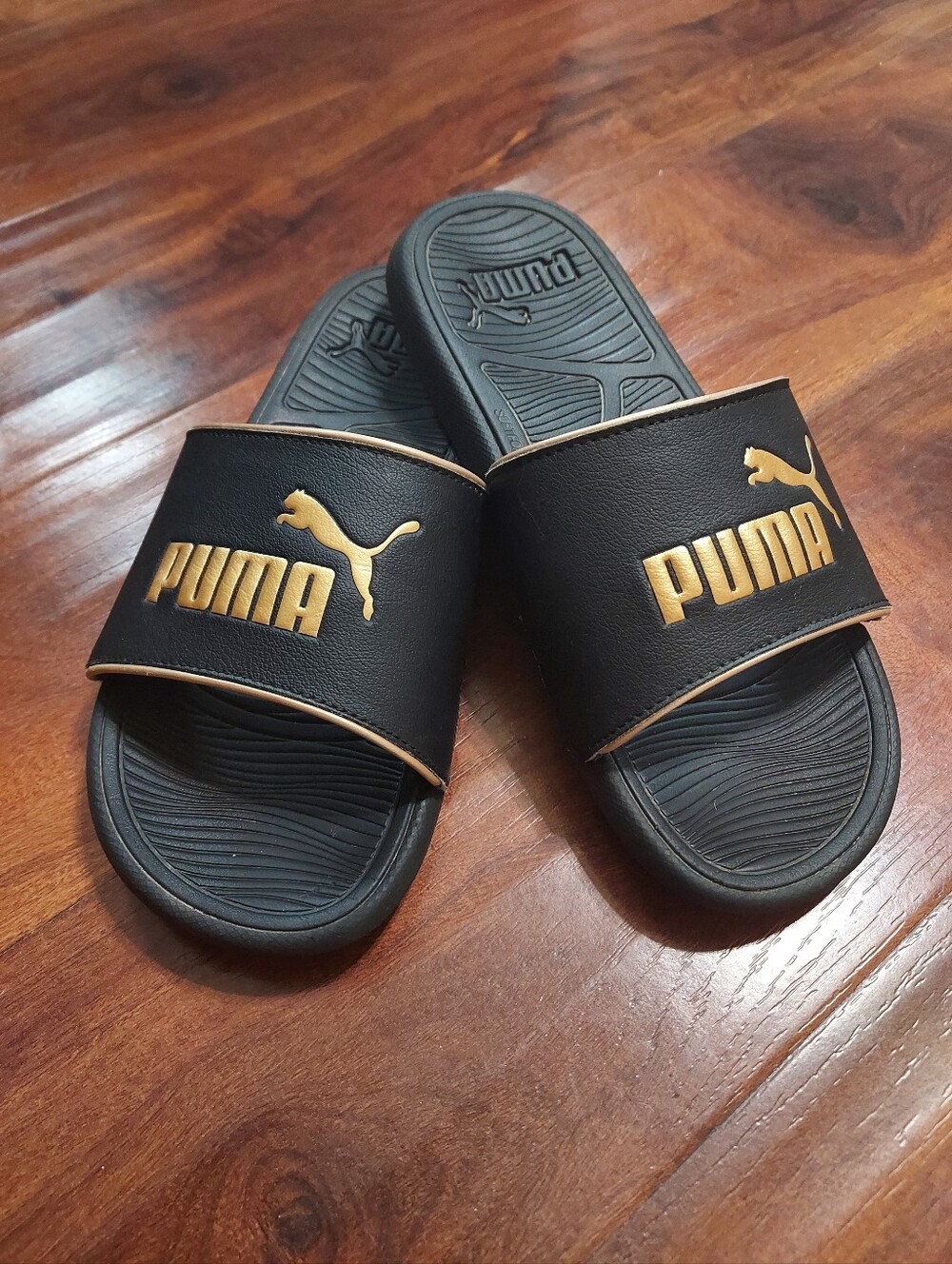 Puma Black Slides with Gold Logo